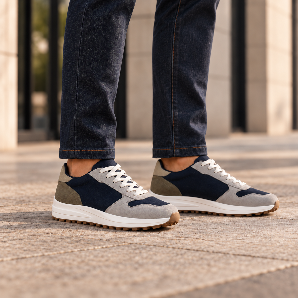 Kosen saturn shoes worn with tailored trousers, close view below the knees. Plain tongues without lace keepers.