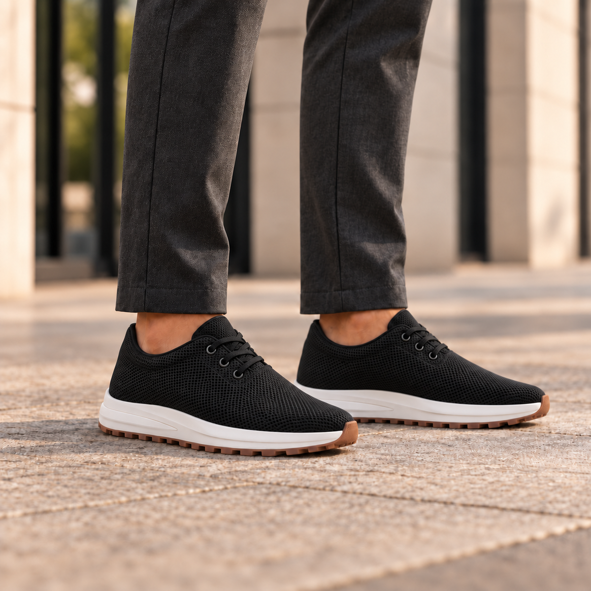 Kosen venus shoes worn with tailored trousers, close view below the knees. Plain tongues without lace keepers.