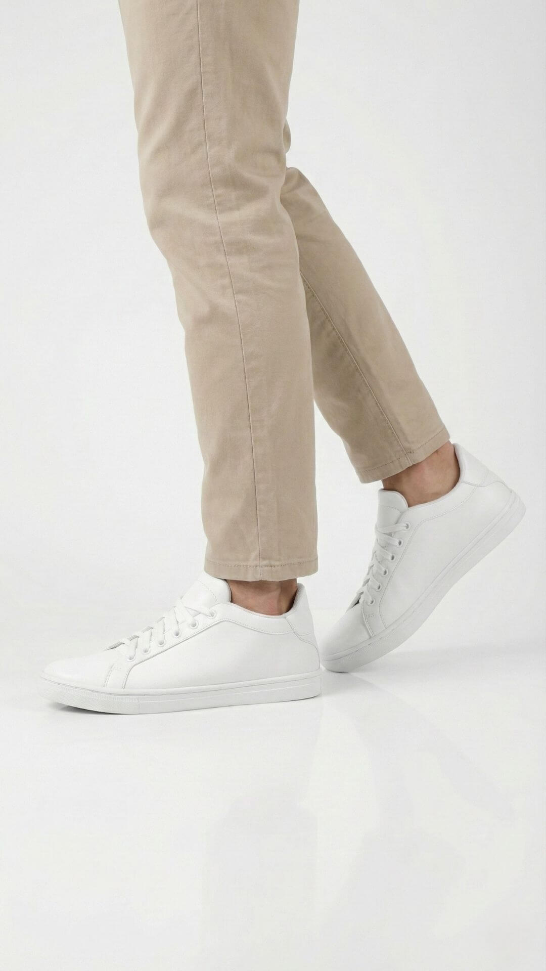 Kosen white elevator shoes providing discreet height increase paired with neutral beige pants