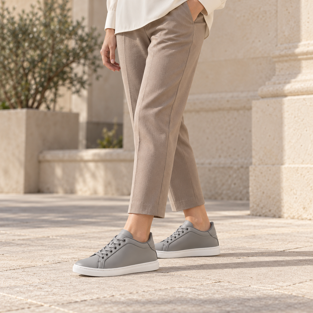 Woman wearing Kosen Mercury Gray elevator sneakers.