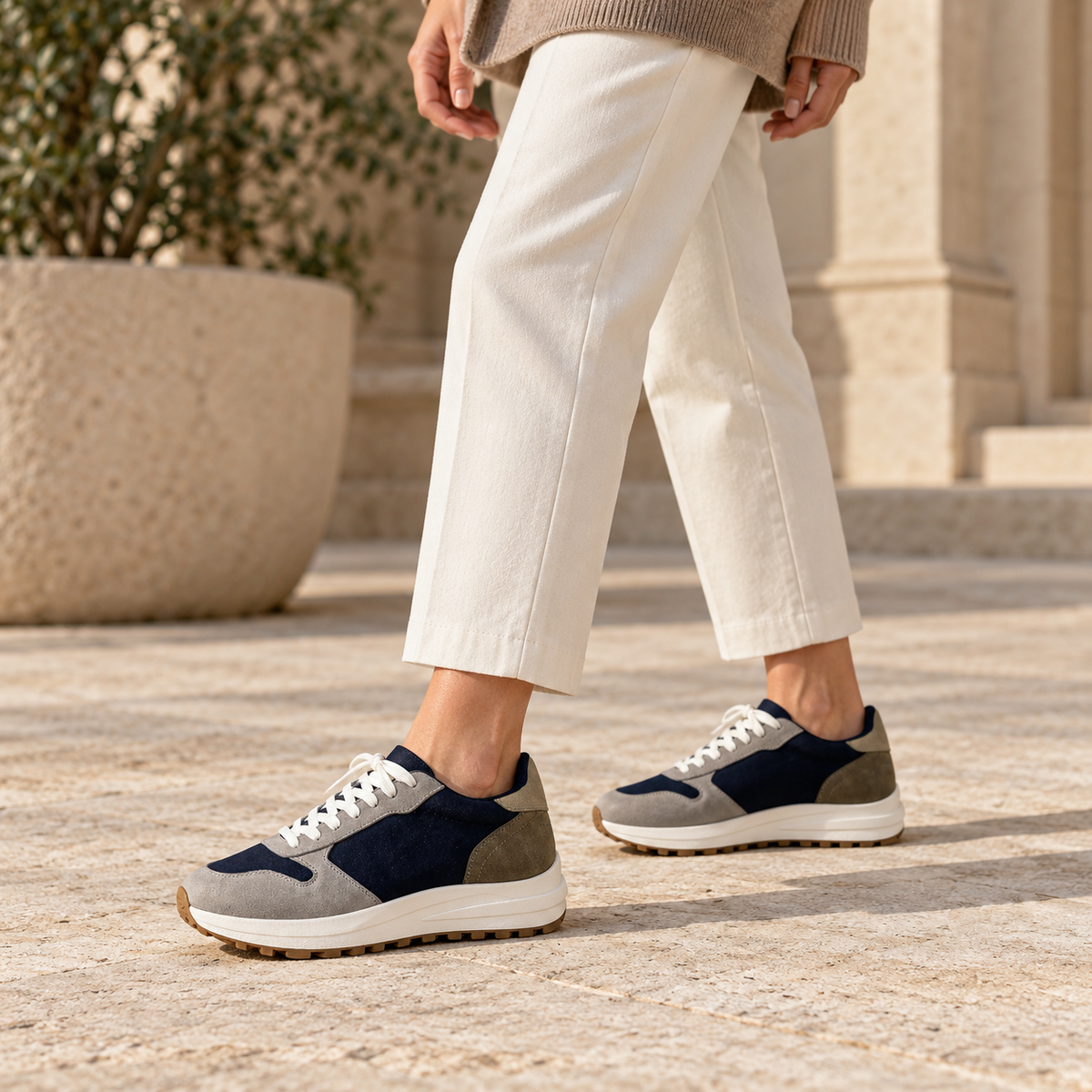 Woman wearing Kosen Saturn Navy elevator sneakers.