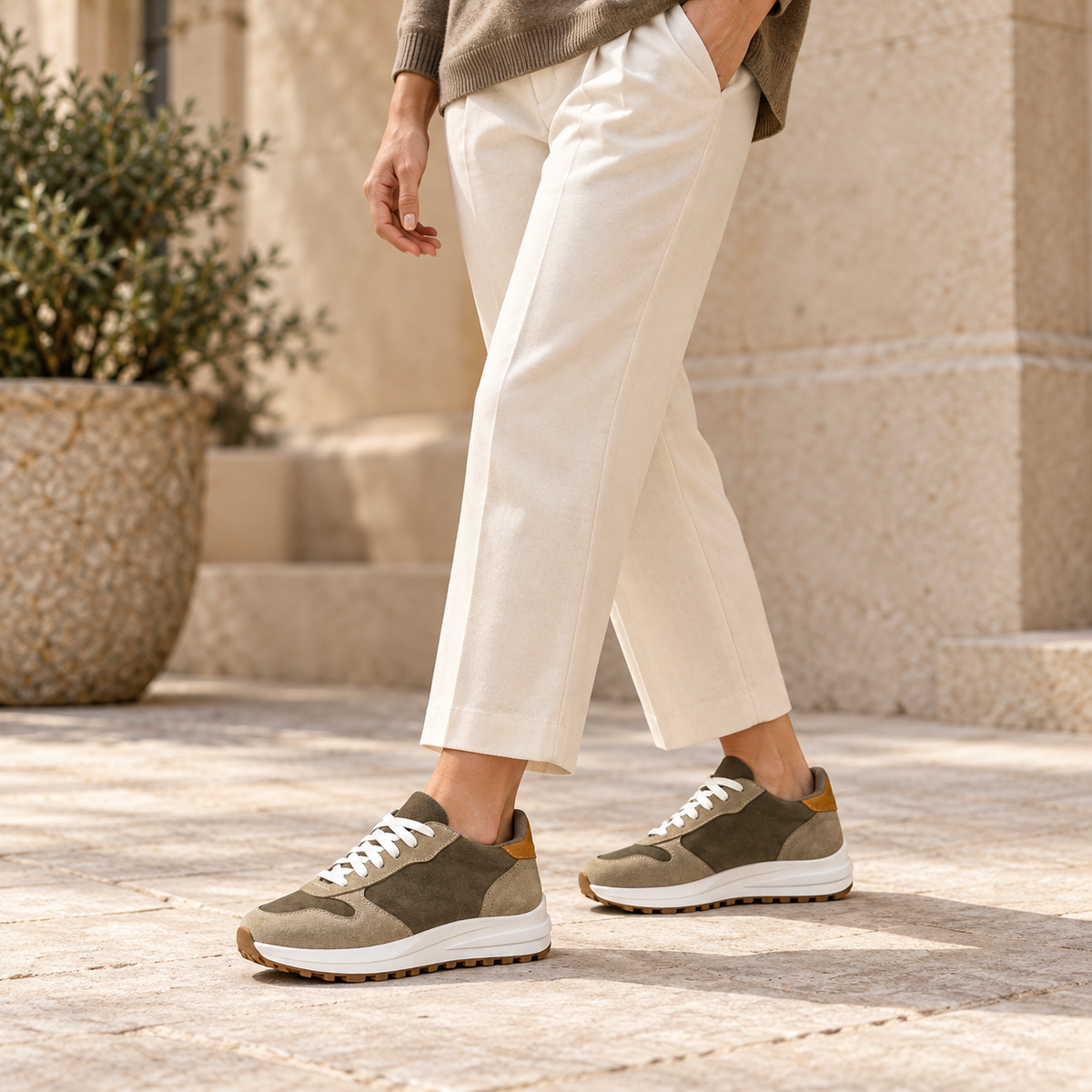 Woman wearing Kosen Saturn Olive elevator sneakers.