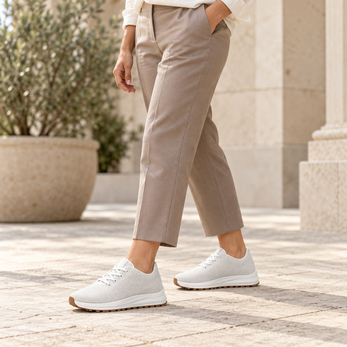 Woman wearing Kosen Venus White elevator sneakers.