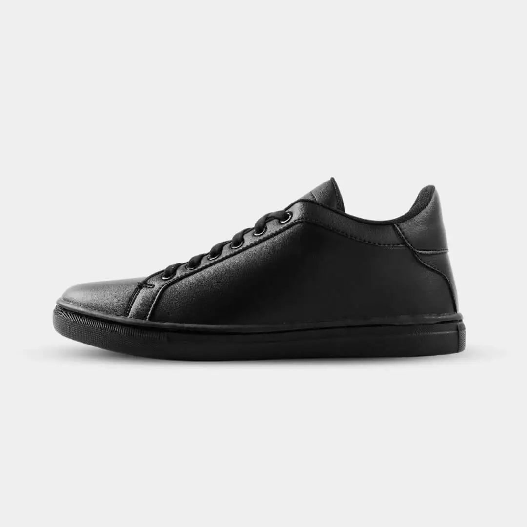 Side view of Mercury All Black elevator sneakers. Minimalist triple black height increasing shoes for men.