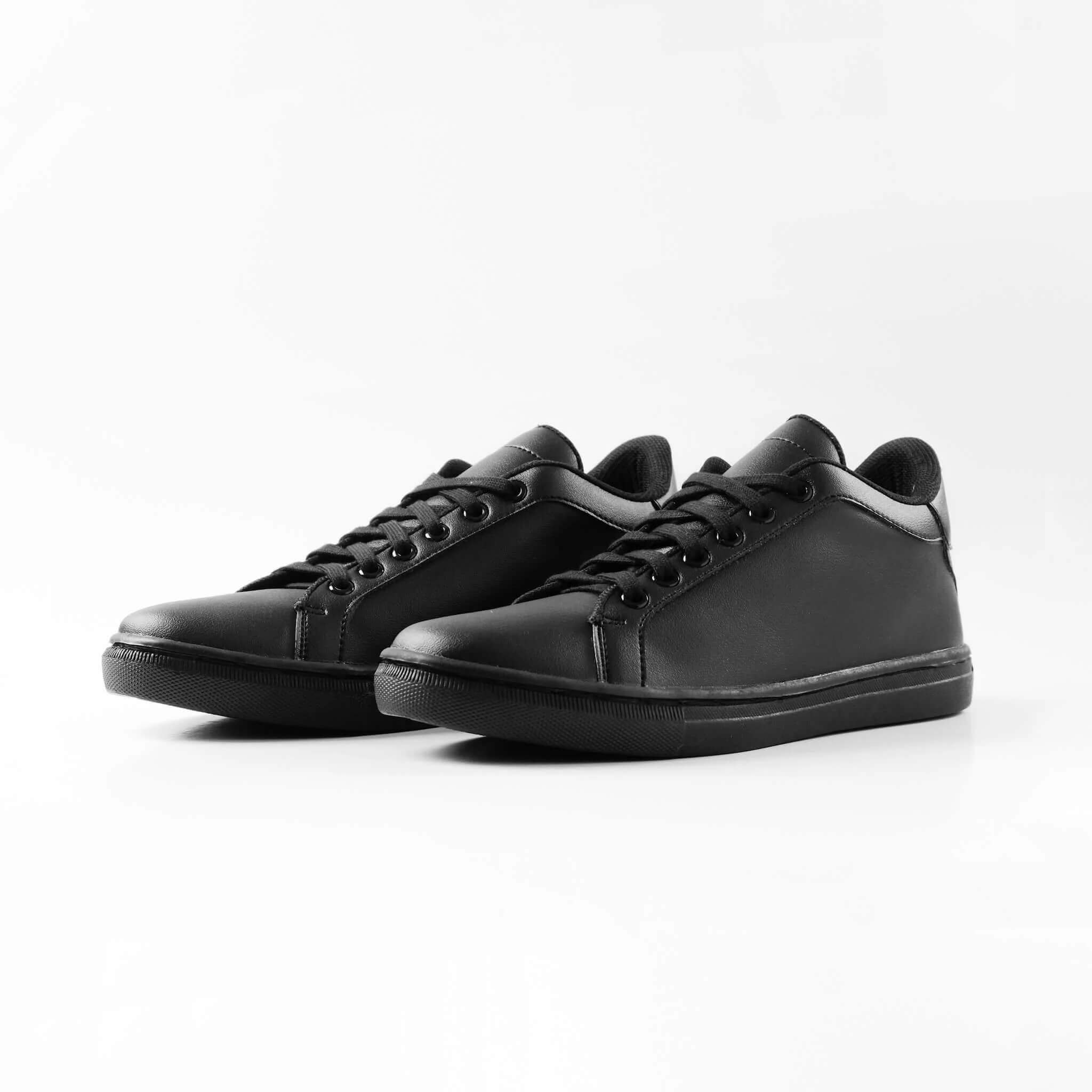 Pair of Mercury All Black elevator sneakers. Synthetic leather monochromatic height increasing shoes with invisible lift.
