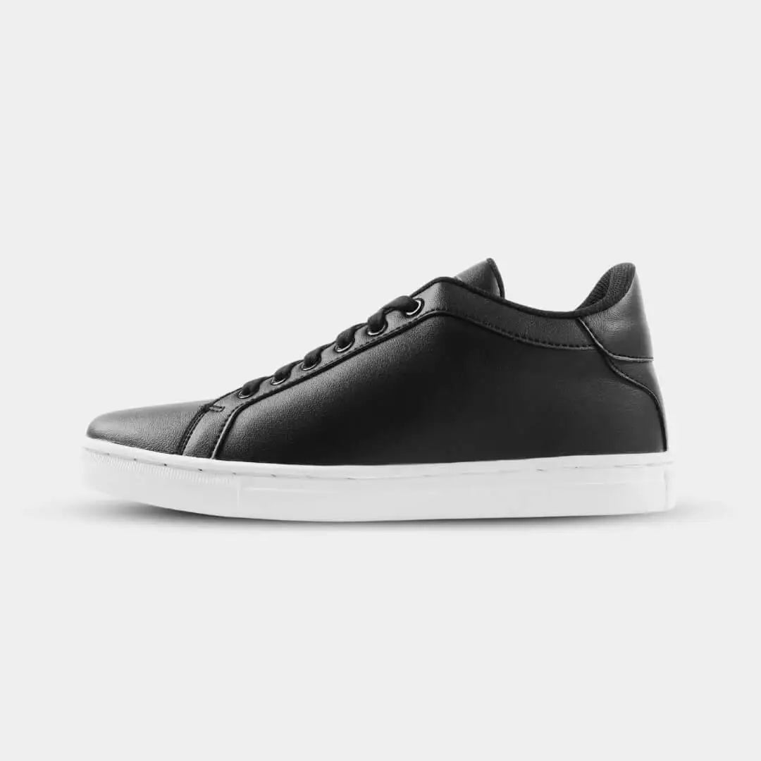 Side view of Mercury Black elevator sneakers. Men's height increasing shoes with white soles for a modern look.