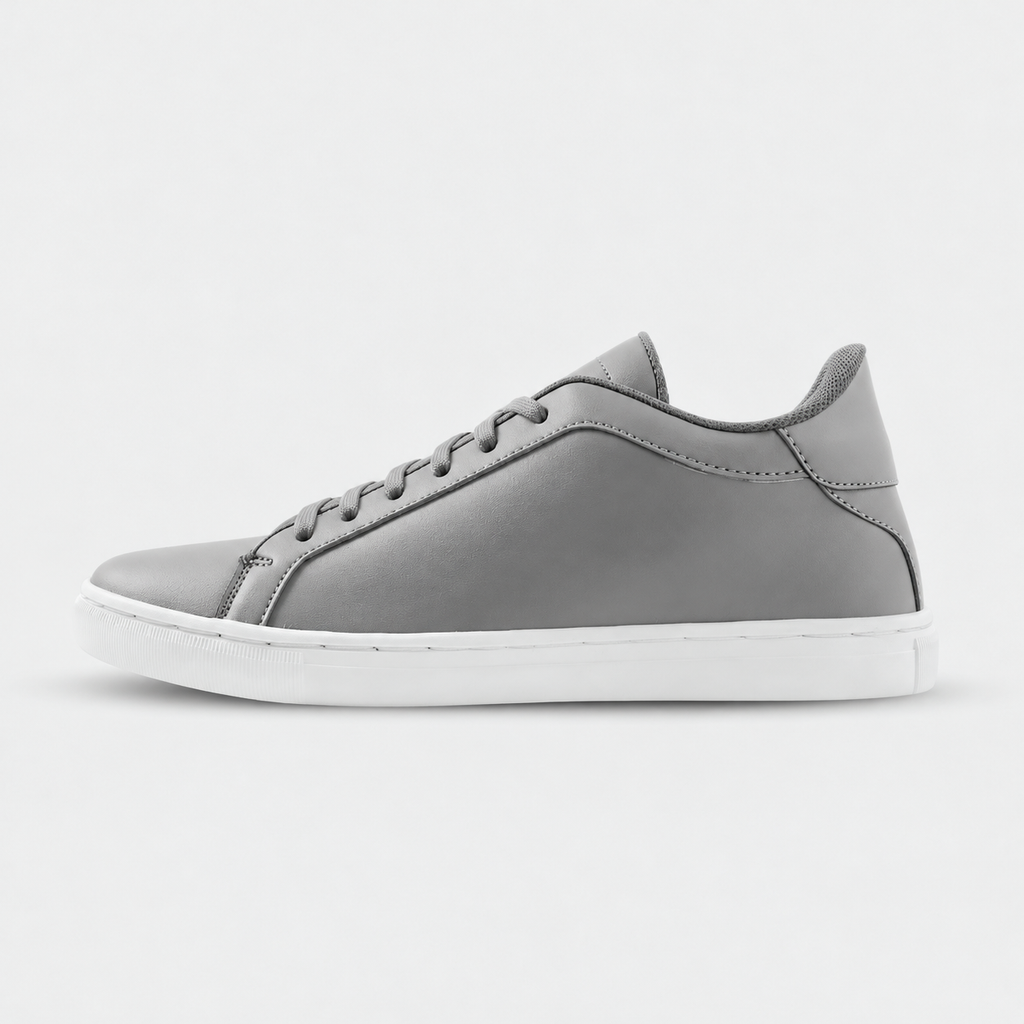 Side view of Mercury Gray elevator sneakers. Minimalist gray height increasing shoes with white soles.
