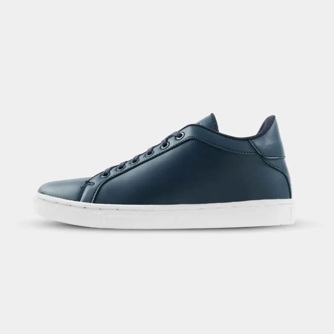 Side view of Kosen Mercury Navy elevator sneakers in deep blue with contrasting white soles.