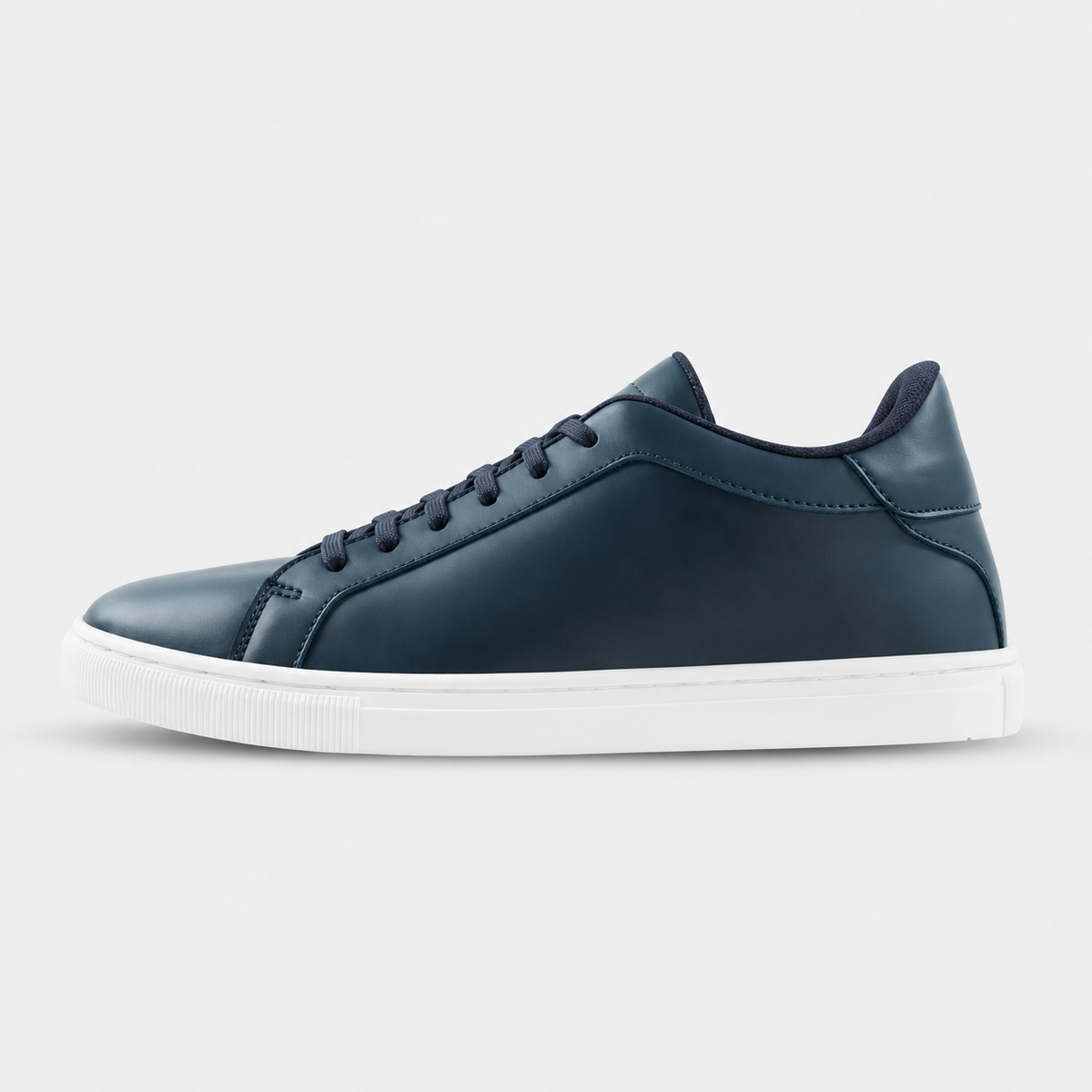 Side view of Kosen Mercury Navy elevator sneakers in deep blue with contrasting white soles.
