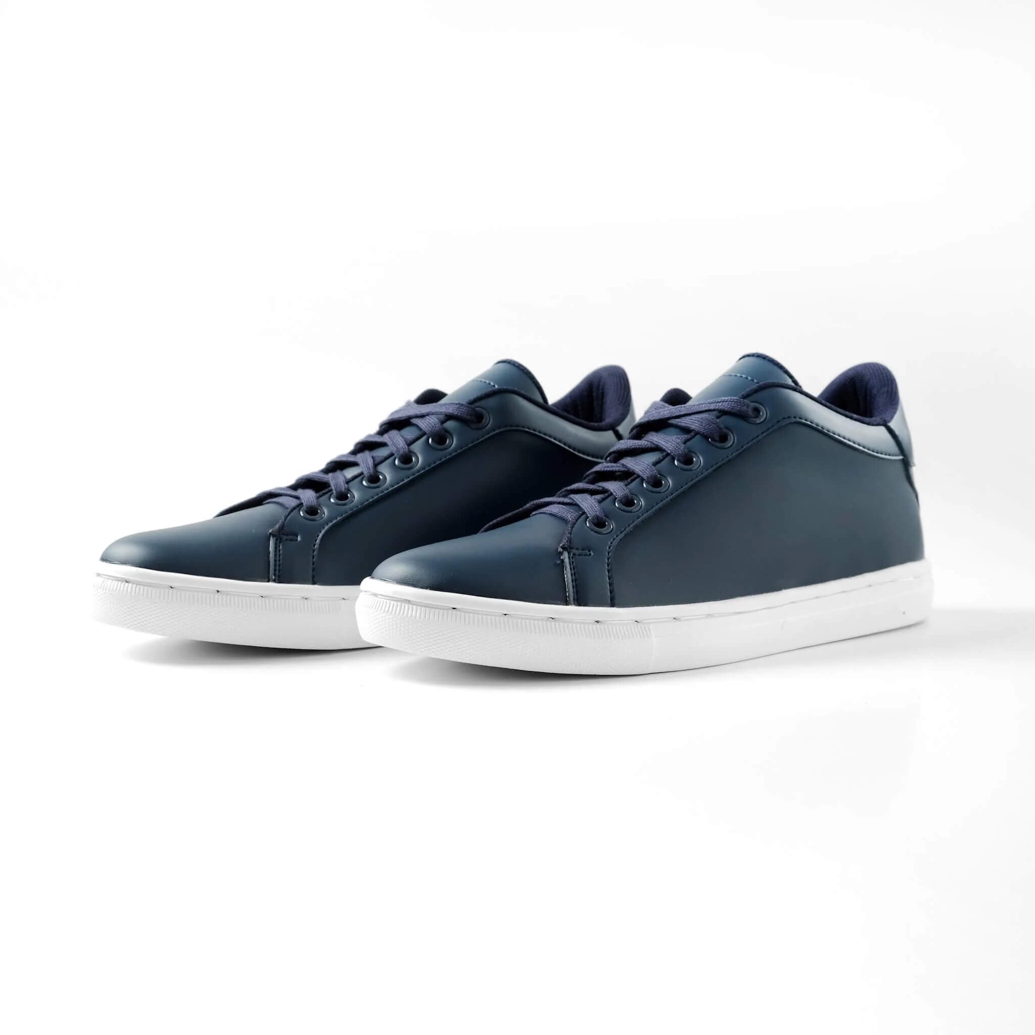Pair of Mercury Navy elevator sneakers. Premium vegan leather height increasing shoes with invisible 2 inch lift.