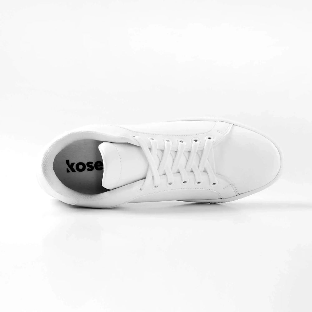Inside view of Mercury White elevator sneakers showing cushioned lining and hidden lift structure.