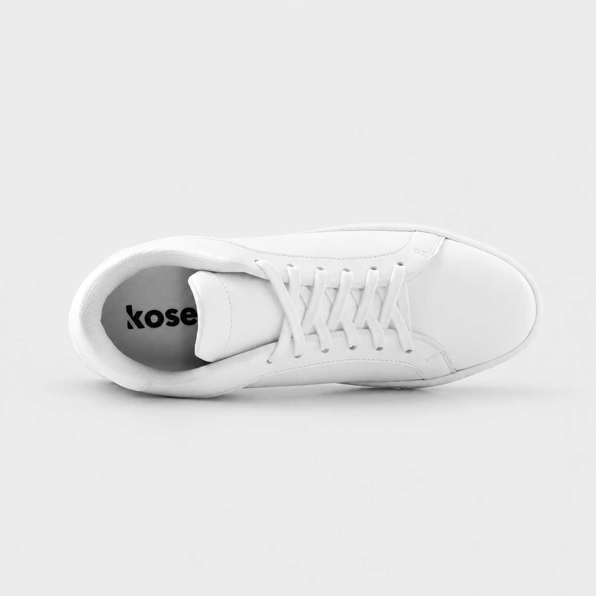 Inside view of Mercury White elevator sneakers showing cushioned lining and hidden lift structure.