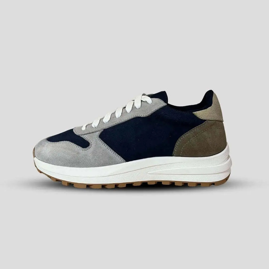 Side view of Saturn Navy elevator sneakers. Retro style blue suede height increasing runners with white midsole.
