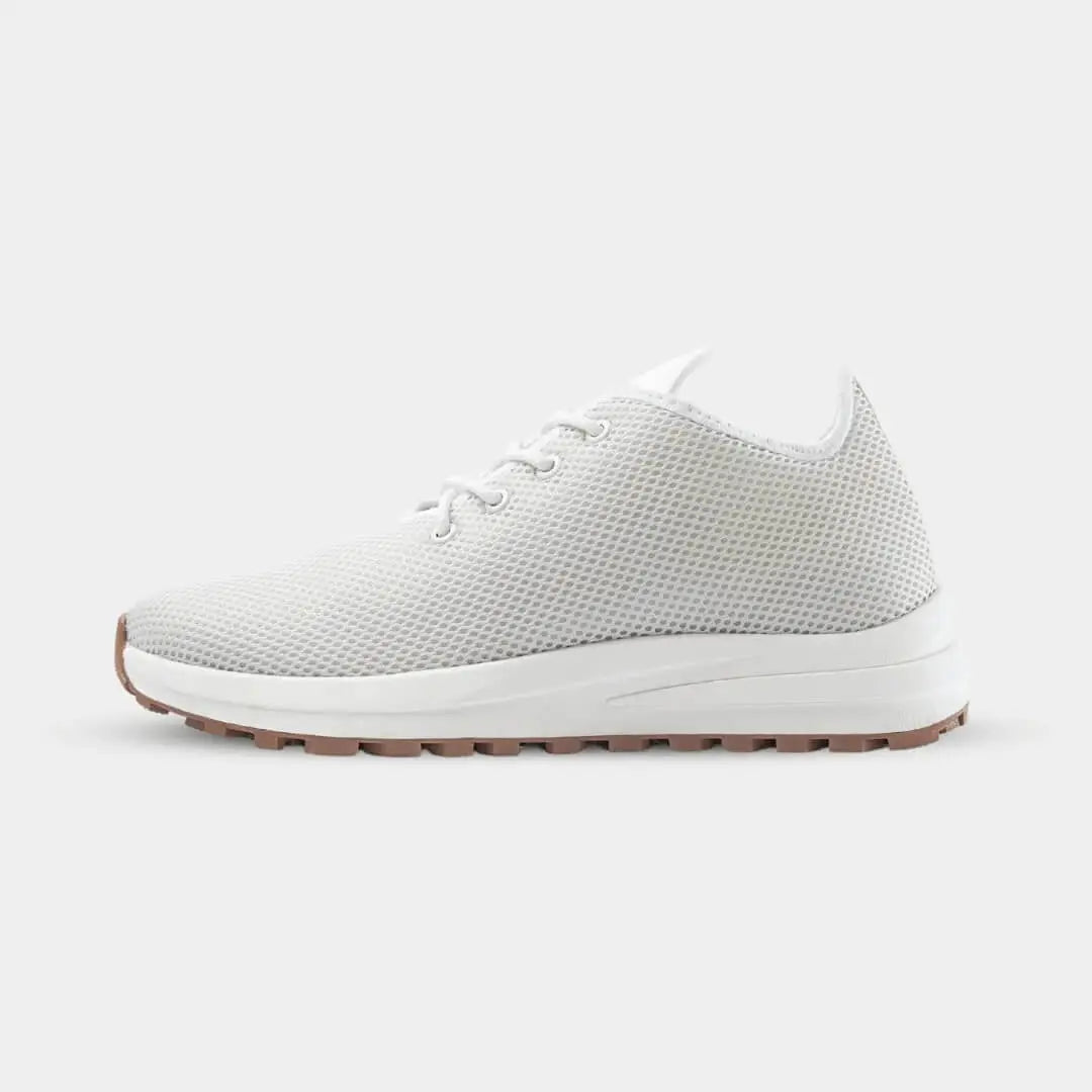 Side view of Venus White elevator sneakers. Breathable white knit height increasing shoes for summer.