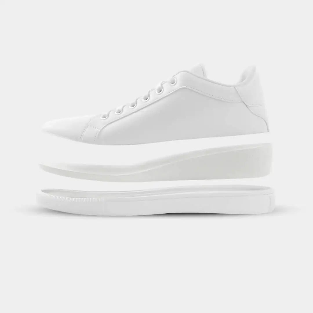 White leather low-top sneaker with a clean, minimalist design and layered sole construction.