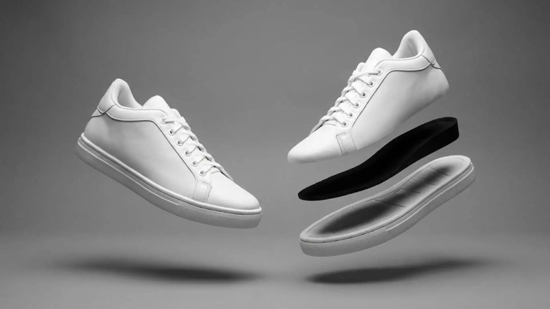 White leather sneakers with clean, minimalist design and white laces.